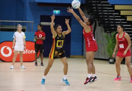 Action from the Tonga (red) and Papua New Guinea game in Suva Photo: Netball Fiji