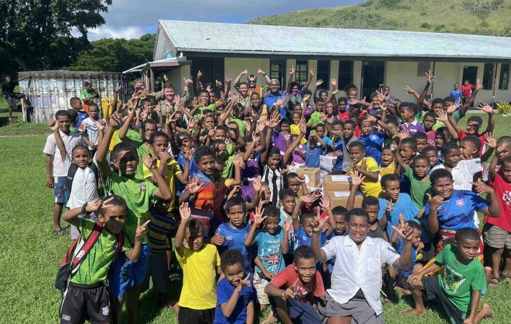 School children in the Yasawa islands group with their new books. [Source: Fiji One News]