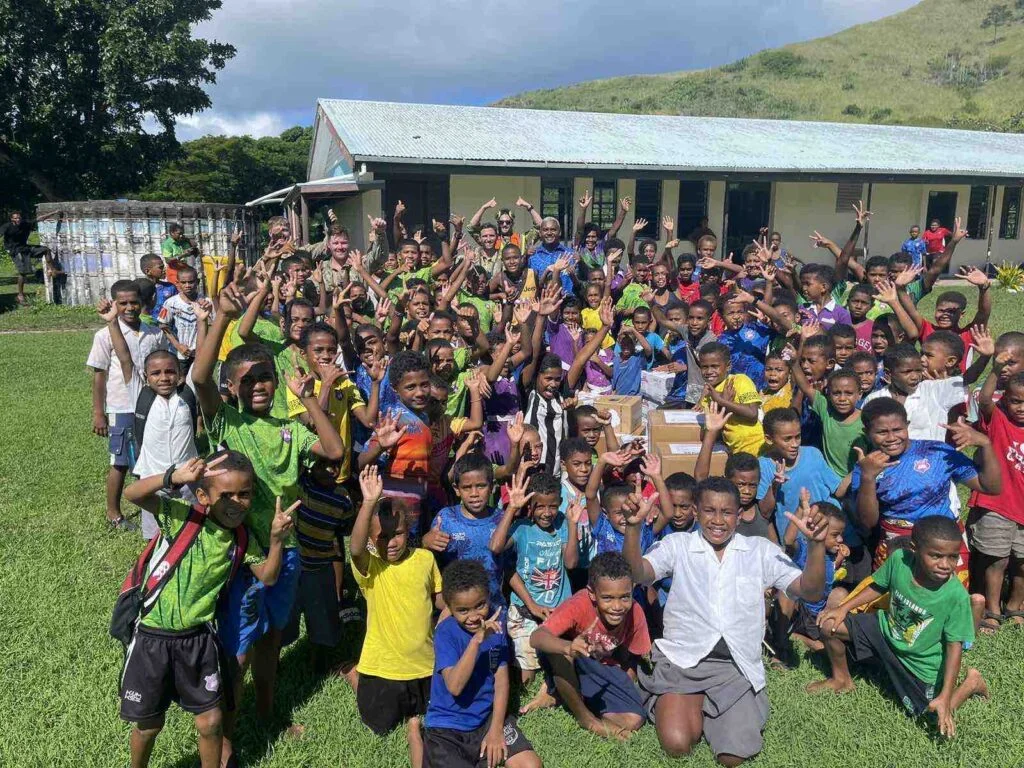 School children in the Yasawa islands group with their new books. [Source: Fiji One News]