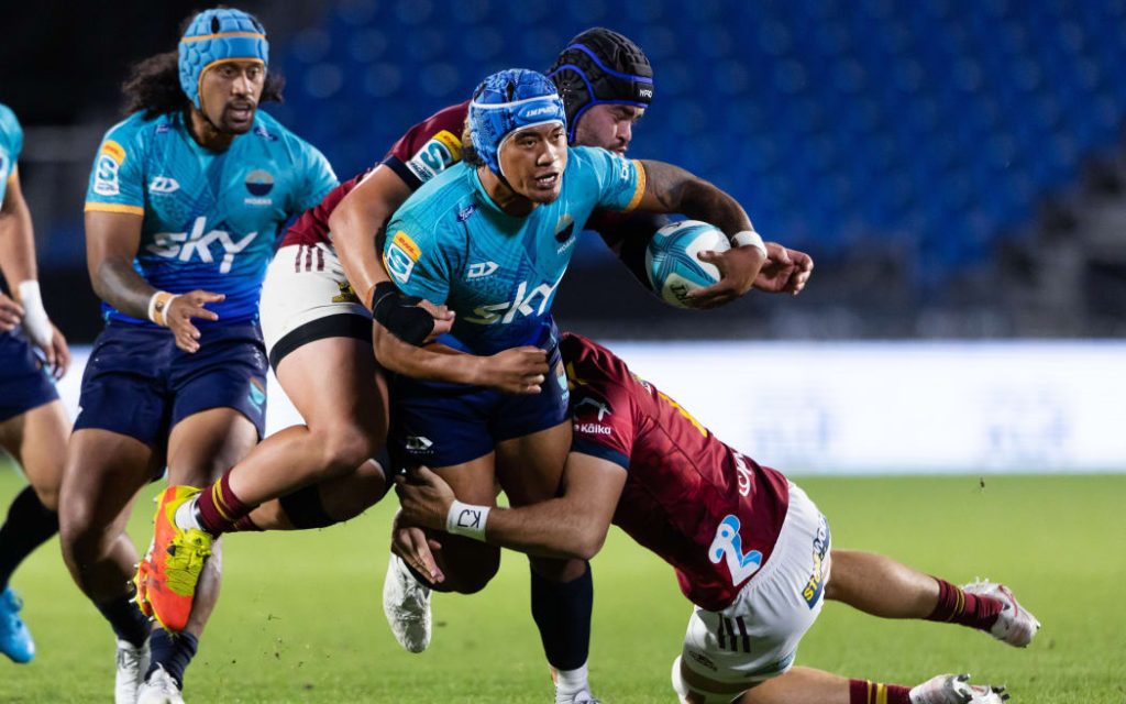 Moana Pasifika midfield back Danny Toala is tackled against the Highlanders in Auckland Photo: Brett Phibbs/Photosport