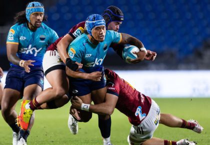 Moana Pasifika midfield back Danny Toala is tackled against the Highlanders in Auckland Photo: Brett Phibbs/Photosport