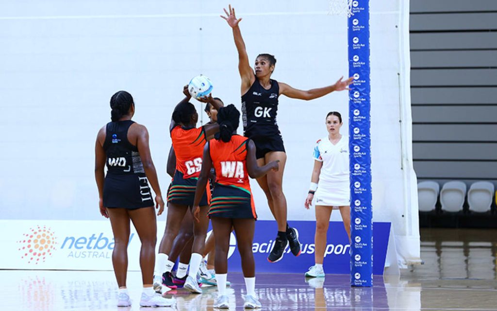 The Fiji Pearls (black kit) against the Malawi Queens on the Gold Coast earlier this year. Photo: Netball Australia